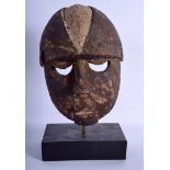 AN EARLY 20TH CENTURY AFRICAN TRIBAL POLYCHROMED WOOD MASK. 28 cm x 15 cm.