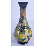 A MOORCROFT HYPERICUM VASE. 17.5 cm high.