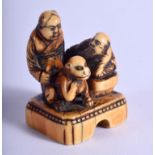 AN 18TH CENTURY JAPANESE EDO PERIOD CARVED IVORY SEAL modelled as a two figures beside a seated mon