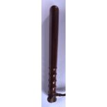 A WOODEN TRUNCHEON, formed with a ribbed handle. 38 cm long.