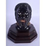 A RARE 19TH CENTURY CONTINENTAL CARVED EBONY BLACKAMOOR INKWELL modelled upon a treen base. 17 cm x