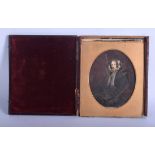 AN EARLY VICTORIAN LEATHER CASED WATERCOLOUR MINIATURE. Image 11 cm x 12 cm.
