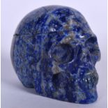AN EARLY 20TH CENTURY CARVED LAPIS LAZULI FIGURE / SCULPTURE OF A SKULL. 4.5 cm x 5 cm.