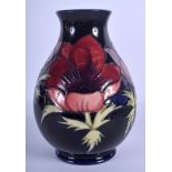 A MOORCROFT HIBISCUS VASE. 20.5 cm high.