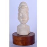 AN EARLY 20TH CENTURY CARVED AFRICAN IVORY BUST, in the form of a female. 19 cm high.