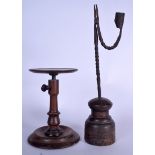 AN ANTIQUE ADJUSTABLE WOODEN PEDESTAL STAND, together with a candlestick holder. Largest 37 cm. (2)