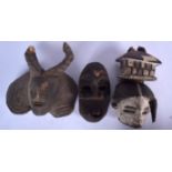 THREE AFRICAN CARVED WOODEN MASKS, varying form. Largest 24 cm x 26 cm. (3)