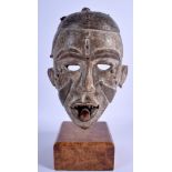 AN AFRICAN CONGO YOMBE POLYCHROMED TRIBAL MASK. 26 cm x 15 cm.