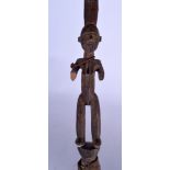 A BURKINA FASO CARVED WOODEN SPEAR, formed with a figural grip. 113 cm long.