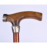 A GOOD LATE 19TH CENTURY RHINOCEROS HORN HANDLED WALKING STICK, formed with white metal mounts. 86.