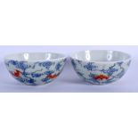 A PAIR OF CHINESE CELADON PORCELAIN TEA BOWLS 20th Century, painted with iron red bats. 8.5 cm diam