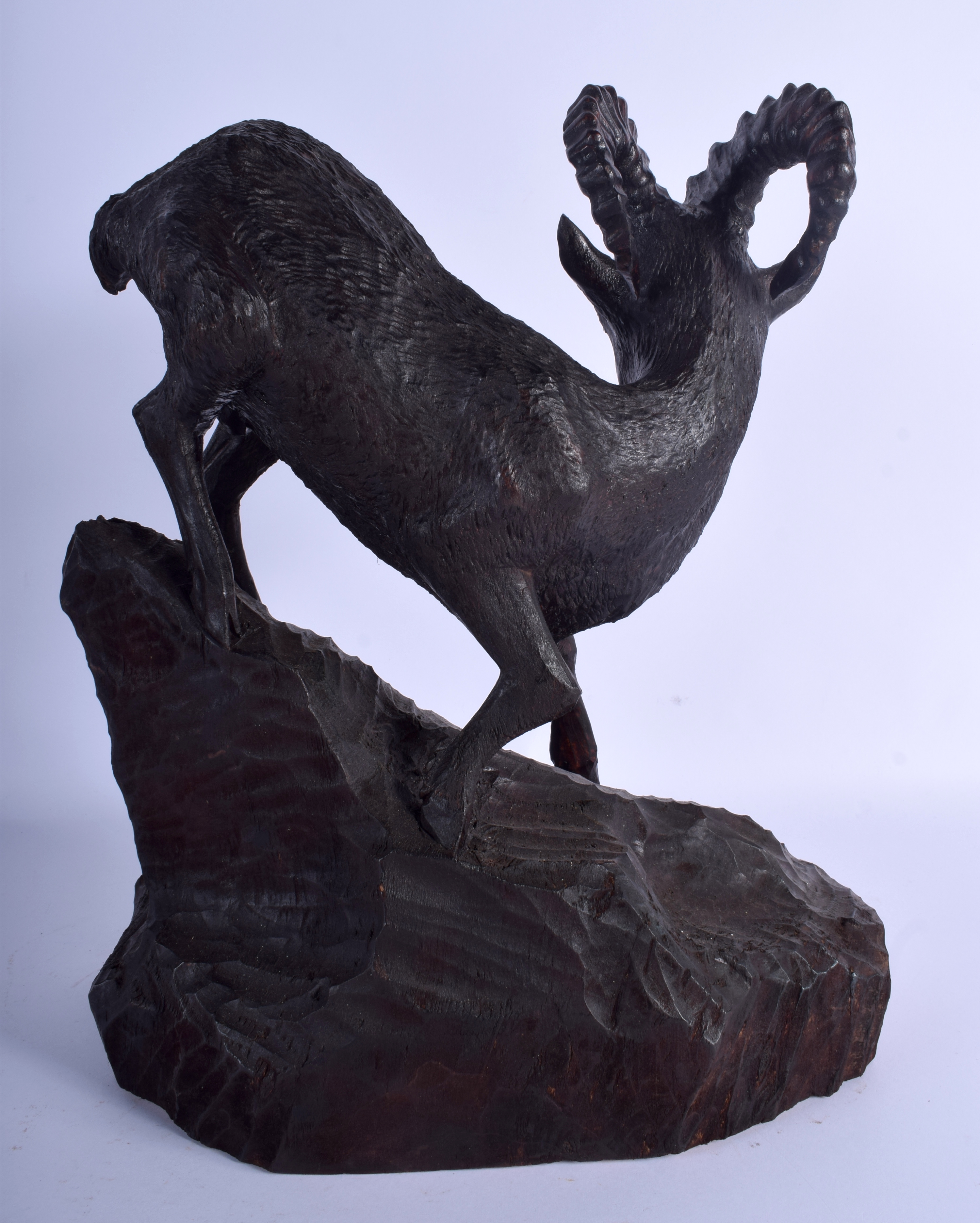 A LARGE ANTIQUE BAVARIAN BLACK FOREST STANDING STAG IBEX modelled upon a naturalistic base. 44 cm x - Image 2 of 3