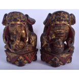 A PAIR OF 19TH CENTURY CHINESE LACQUERED BUDDHISTIC LION FOO DOGS. 20 cm x 8 cm.