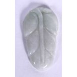 AN EARLY 20TH CENTURY CHINESE CARVED JADEITE PENDANT IN THE FORM OF A LEAF, naturalistic in form. 4