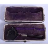 A BOXED LIEBREIGHS OPHTHALMOSCOPE. 9.5 cm long.