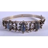 A VICTORIAN MOONSTONE AND PEARL BANGLE. 6 cm wide.