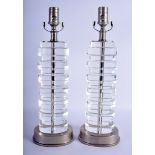 A STYLISH PAIR OF ART DECO CRYSTAL GLASS LAMPS. Glass 32 cm x 10 cm.