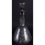 AN ART NOUVEAU SILVER OVERLAID GLASS DECANTER. 22 cm high.