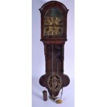 AN ANTIQUE EUROPEAN HANGING WALL CLOCK with copper urn open motif. 81 cm x 18 cm.