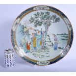 A LARGE 19TH CENTURY CHINESE FAMILLE VERTE PORCELAIN CHARGER Kangxi style, painted with figures bes