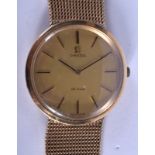 A GOOD 9CT GOLD OMEGA DE VILLE WRISTWATCH with gold strap. 54.4 grams overall. 3 cm wide, strap 16