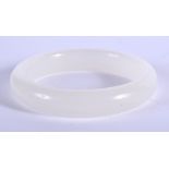 A CHINESE WHITE JADE BANGLE 20th Century. 7 cm wide.