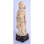 A 19TH CENTURY CHINESE CARVED IVORY FIGURE OF SHOU LAO SAGE Qing, modelled holding a peach. Ivory 2