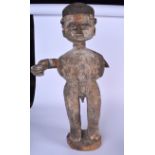 AN AFRICAN CARVED TRIBAL FIGURE, formed with polychromed eyes. 62 cm high.