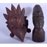 AN AFRICAN CARVED WOOD FIGURE OF A MALE by D S Miller, together with an Indian mask. (2)