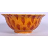 A CHINESE PORCELAIN BOWL BEARING MING MARKS, decorated with a speckled glazed. 15.5 cm wide.