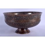 A LARGE 17TH CENTURY SAFAVID TINNED COPPER BOWL Persia, decorated with extensive scripture and foli