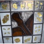 A GLASS WINDOW OF MUSICAL INTEREST, the central panel depicting the neck of a violin. 49 cm x 45 cm