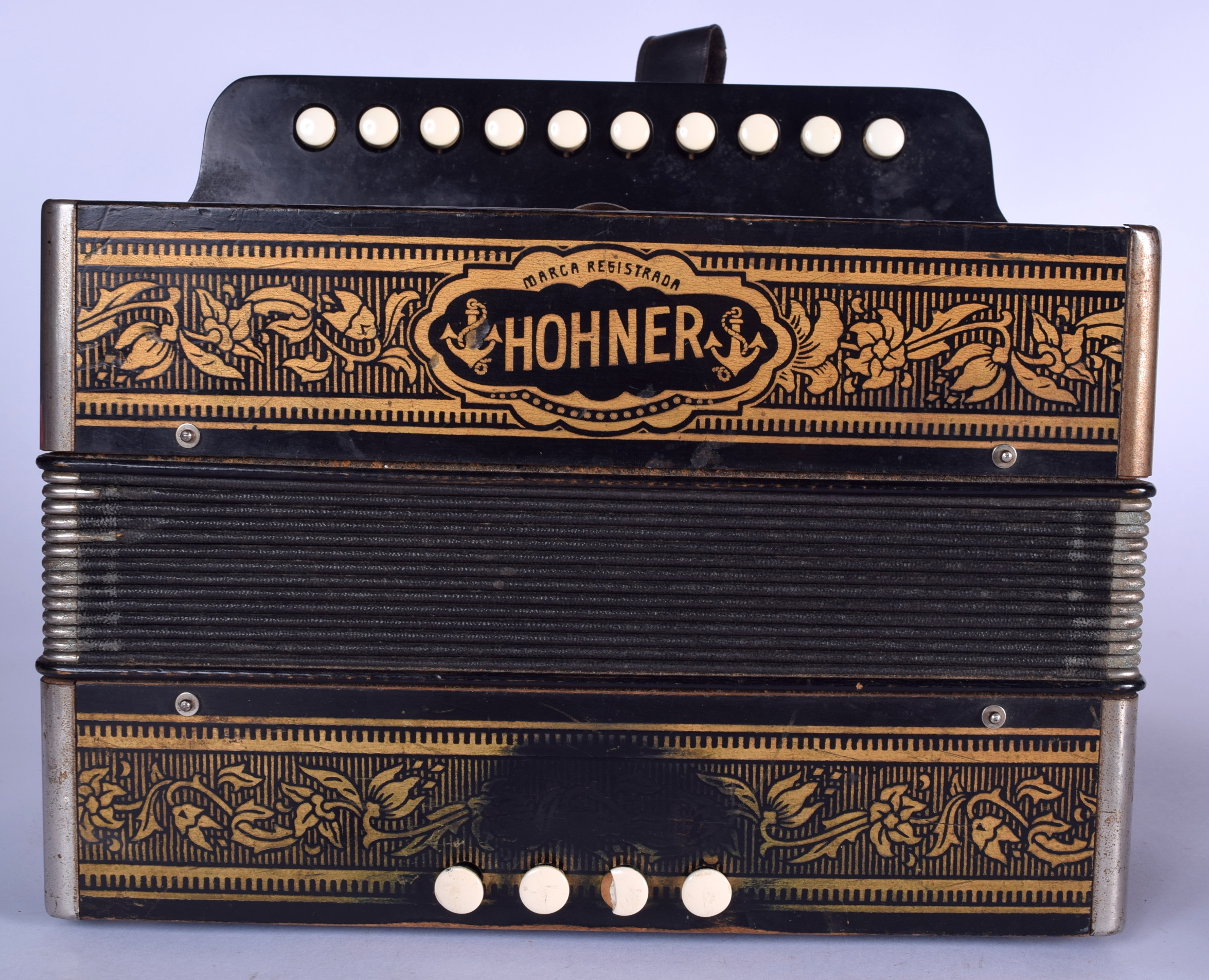 AN ANTIQUE HOHNER SQUEEZEBOX ACCORDION, formed with ten keys. 25 cm x 28 cm.