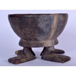 A MALIAN DOGON WOODEN FOOTED BOWL, formed with human like feet. 16.5 cm x 21 cm.