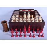 A LOVELY VICTORIAN ANGLO INDIAN CARVED AND STAINED IVORY CHESS SET with draught pieces, contained w