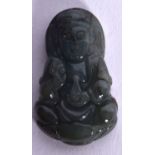 A CHINESE CARVED SPINACH JADE PLAQUE PENDANT, depicting a seated Guanyin. 3.25 cm long.