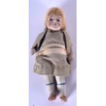 AN UNUSUAL EARLY 20TH CENTURY EUROPEAN PORCELAIN DOLL with original clothing and fully porcelain li