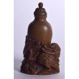 AN UNUSUAL CHINESE CARVED HORN SNUFF BOTTLE, formed with a dragon wrapped around its body. 8 cm hig