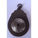 A PERSIAN INLAID ASTROLABE, decorated with extensive foliage. 18 cm x 11 cm.
