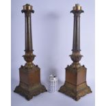 A LARGE PAIR OF 19TH CENTURY FRENCH BRONZE EMPIRE TYPE CANDELABRA overlaid with scrolling acanthus