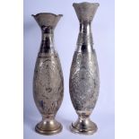 A LARGE NEAR PAIR OF 19TH CENTURY PERSIAN SILVER VASES decorated with foliage and birds. 78 oz. 48