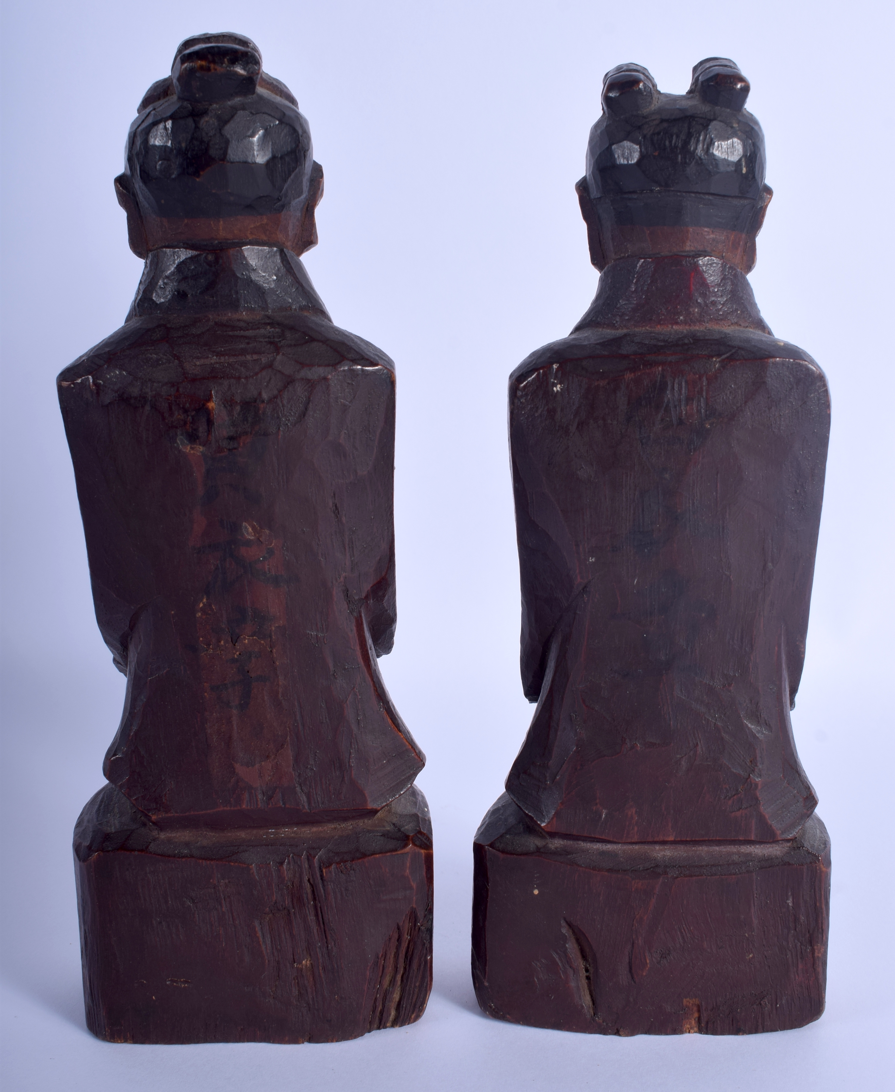 A PAIR OF 19TH CENTURY KOREAN JOSEON DYNASTY CARVED WOOD BUDDHAS modelled upon wooden plinths. 23 c - Image 2 of 3