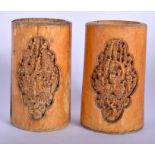 A PAIR OF 19TH CENTURY CHINESE CANTON IVORY CYLINDRICAL VASES Qing, carved with figures and landsca