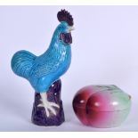 A CHINESE BLUE GLAZED PORCELAIN COCKEREL, together with a peach box. Figure 25 cm high. (2)