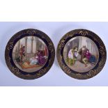 A PAIR OF ANTIQUE ROYAL VIENNA PORCELAIN CABINET PLATES painted with classical scenes. 24 cm diamet