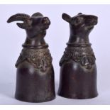A BRONZE CUP IN THE FORM OF A RAM, together with a rat. 6 cm high. (2)