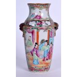 A 19TH CENTURY CHINESE FAMILLE ROSE CANTON ENAMEL PORCELAIN VASE, painted with figures in an interi