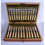A CASED SET OF ANTIQUE SILVER PLATED IVORY KNIVES AND FORKS. (24)
