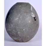 A CENTRAL ASIAN STONE PLINTH, egg shaped with a flattened top. 19.5 cm x 15 cm.