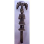 A WEST AFRICAN CARVED WOODEN SCEPTRE, figural in form. 48 cm long.